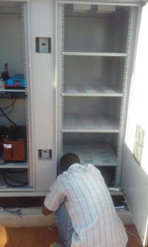 Rural Concreteless Lattice Tower - Radio equipment being installed in shelter