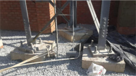 Narrow based parallel towers for erection in confined spaces.